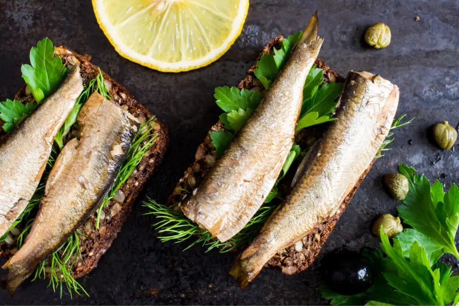 Mood boosting foods- sardines on brown breas with corriander and a slice of lemon